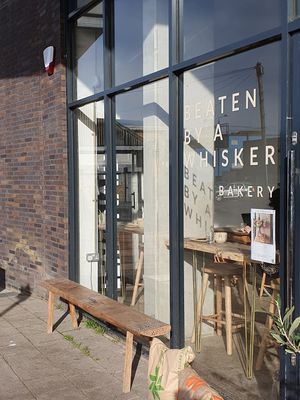 Outdoor seating at Beaten by a Whisker in London