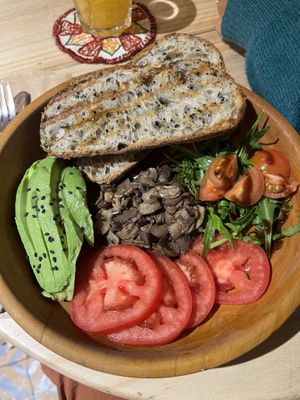 Very tasty vegan breakfast with orange juice and tea  at UKAW Chocolate in Miraflores