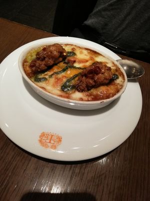A type of paella with saffron + two vegan chicken pieces at T's Restaurant in Tokyo