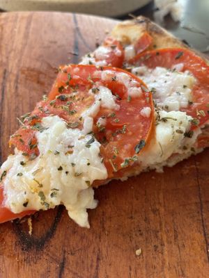 It was so good that we forgot to take a picture until there was only one slice left...  at Coral Vegan Pizza in Playa Del Carmen