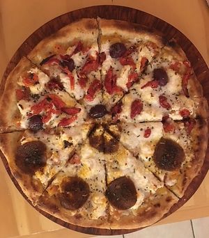 Pepperoni on one side, sundried tomatoes on the other.  at Coral Vegan Pizza in Playa Del Carmen