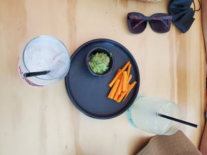 drinks + something to eat while waiting for pizzas. at Coral Vegan Pizza in Playa Del Carmen