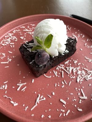 Chocolate brownie with coconut ice cream 😍  at Coral Vegan Pizza in Playa Del Carmen