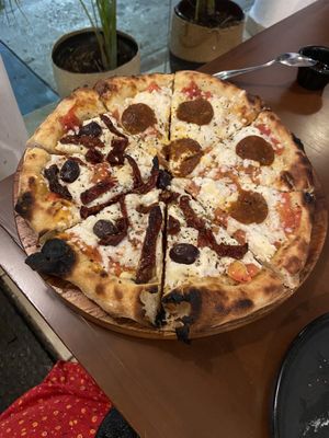 Half sundried Cozumel, half pepperoni de mar   at Coral Vegan Pizza in Playa Del Carmen