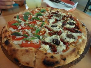 Pizza half Primavera half Cozumel at Coral Vegan Pizza in Playa Del Carmen