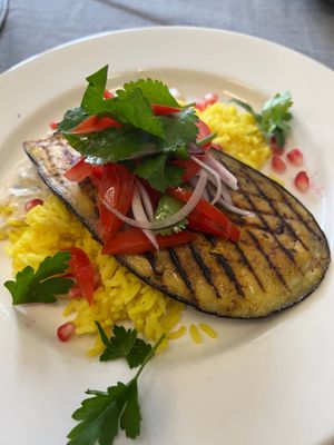 Grilled spiced aubergine on safron rice at Eat To The Beat in Aylesbury