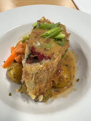 Beetroot wellington with creamy vegan gravy and whole potatoes with carrots and broccoli  at Eat To The Beat in Aylesbury