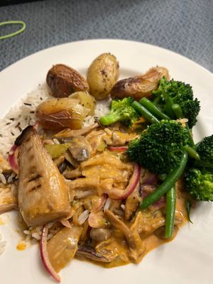 Mushroom curry and rice with green veg at Eat To The Beat in Aylesbury