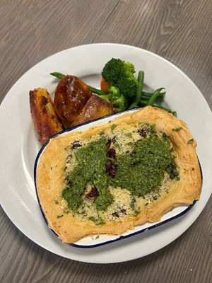 Vegan home-made puff pastry pie lentil pie with pesto on top and sun dried tomato’s with green veg and roasted potato’s  at Eat To The Beat in Aylesbury