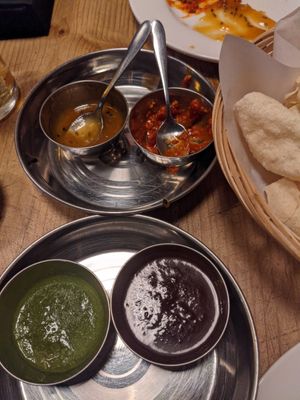 Chutneys !! Ask for vegan they bought us coriander/chilli and tamarind rather than the yoghurt one at Bambukat in Sheffield