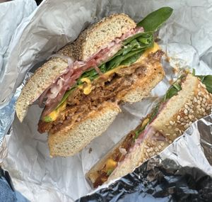 Build your own hot sandwich: Sesame bagel, vegan pastrami, vegan cheddar, spinach, tomato, onion with vegan Russian dressing  at Pearl's Bagels & Bakery in Albany