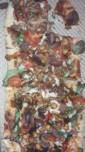 This is my &Pizza, they have finishers,  toppings you add after the pizza is done. Such as arugula, olives ,onions and some other toppings and sauces. at & PIZZA in Nottingham