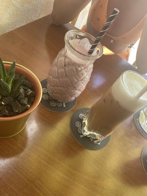 Red love smoothie and oat milk iced latte  at Neighbours in Tenerife