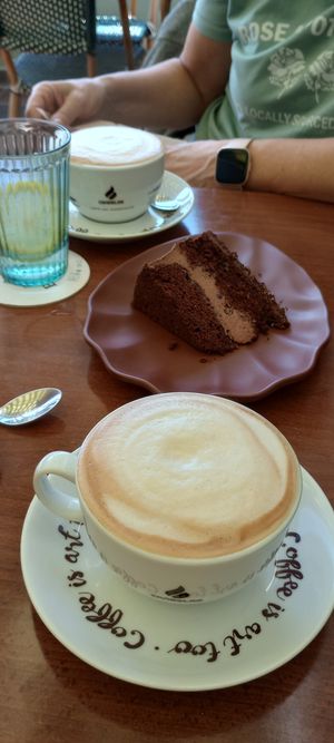 Chocolate and cherry cake with soya cappuccino. at Neighbours in Tenerife