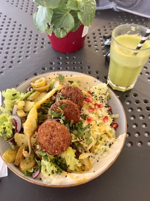 Bowl falafel and kale apple ginger juice  at Green Way - Food For Life in Sopot
