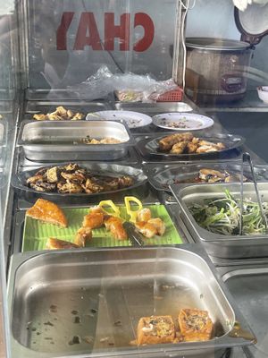 Those are for the plate and meal boxes   at Quán Chay Thiện Tâm in Nha Trang