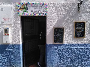 Outside the shop at El kamaleon sabroson in Granada