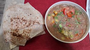 Foul (fave bean and chickpea stew) and saj bread at Colsaj in Trieste