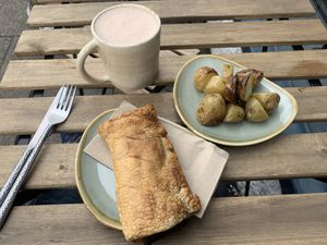 Vegan sausage roll, roast potatoes and chai   at Zola's Bakery in Galashiels