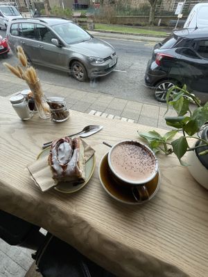 Cinnamon bun and oat milk hot chocolate   at Zola's Bakery in Galashiels