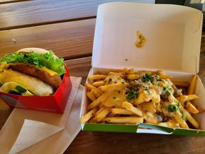 Fried chicken sandwich and loaded plant fries at Plantees in Orlando