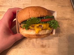 Single Signature Burger- Plant-based patty, vegan cheese, grilled onions, plant sauce, lettuce, tomato, and pickles at Plantees in Orlando
