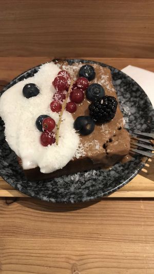 Vegan banana bread with coconut cream and berries   at Hanging Out Café in Hamburg