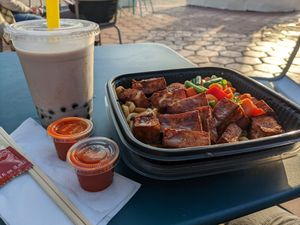 Boozy boba (rum + horchata + tapioca) Noodle bowl with tofu (protein 3x) Sriracha and soy sauce available on the side at Tuk Tuk Eatery in San Diego