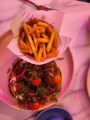 Plant base meatballs on flatbread. Tomatoes, pink onion and salsa Verde. Paprika fries. #Veganuary at Laila in Edinburgh