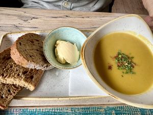 Lentil curried soup with bread   at High St Merchants in Grantown On Spey