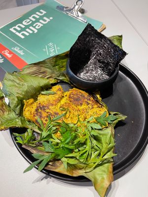 Grilled Otak Otak
Made with Tofu, Seaweed, Coconut Cream, 6 Spices, Candlenut, Mushroom Seasoning
and Rice Flour, Corn Flour and top with Organic Micro-greens, wrapped in Banana  at Hijau - 绿 in Kuala Lumpur