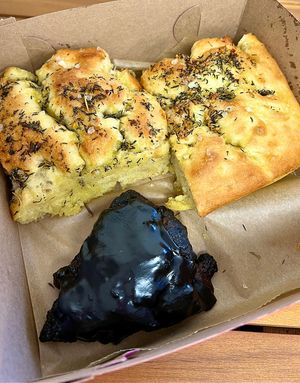 October Special 🎃👻 Black Magic chocolate scone 🖤 and my fav garlic-rosemary focaccia   at Val's Bakery in Dayton