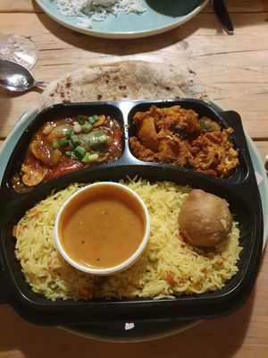 Thali meal for one. Starter: Kachori. 2 Curries: Aloo Gobi and Mushroom Masala. Rice: Pulav at RK Dining in Preston