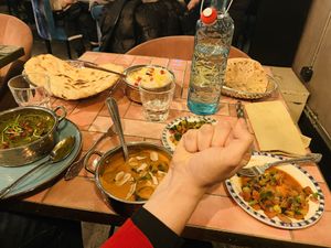 Chaotic mixture of (from left to right): Palak chana; plain naan bread; palak kofta; kachumber salad; roti  bread; kachumber salad 2.  at Masala Kitchen in Gothenburg