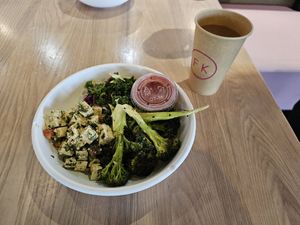 Caprese Tofu, Brocoli, and kale slaw with housemade sriracha on the side. at Fresh Kitchen in Gainesville