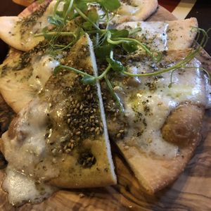 Flatbread with vegan cheese   at Otto Vegan Empire in Stockport