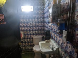 Men's bathroom  at Tamagotchi (filled with hentai) at Tamagotchi in Medellin