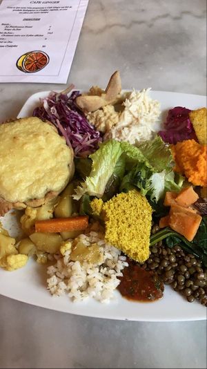 Plate with spinach potato pie  at Cafe Ginger in Paris