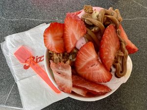 Vegan ice cream with berries, chocolate chips, and Biscoff sauce & crumbs  at Reddy's Marvellous Dessert Parlour in Aberdeen