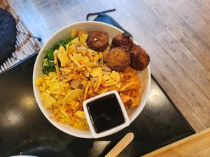Large bowl with falafel, tofu, rice, some veg at Poké Perfect in The Hague