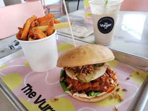 Buffalo chicken burger, 50/50 (potato and sweet potato) fries, and a biscoff milkshake at The Vurger Co in Manchester