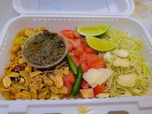 Tea Leaf Salad! So good! Order it w/o shrimp paste to make it vegan at Burmese Bites - Food Stall in Queens