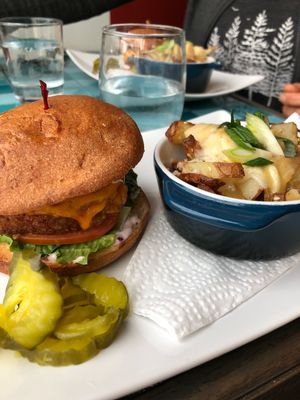 east side burger with poutine  at Chomp Vegan Eatery in Vancouver