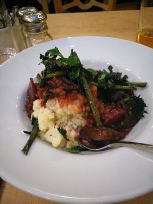 Beetroot, portobello mushroom and lentil bourguignon with green beans and crispy kale, served with mashed potatoes.  at Saramago Cafe Bar in Glasgow