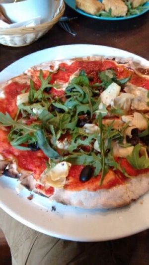 fab pizza, artichoke, olives, capers, rocket and balsamic at Saramago Cafe Bar in Glasgow