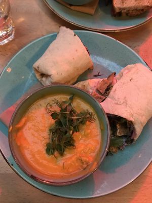 Smoked carrot soup and tofu, chilli and ginger slaw wrap  at Saramago Cafe Bar in Glasgow
