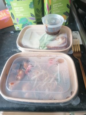 Takeaway boxes, ready to go home at Tofu Vegan - Golders Green in North West London