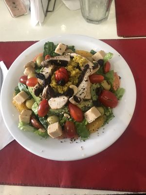 Salad with chickpea cheese cubes  at Naturaleza Sabia in Buenos Aires