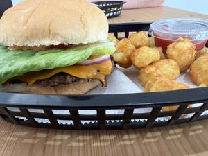 Smash burger with tater tots  at Stephanie's Vegan Bakery + Cafe in Fort Lauderdale