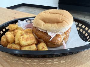 Hot maple crispy chik’n sandwich with tater tots  at Stephanie's Vegan Bakery + Cafe in Fort Lauderdale